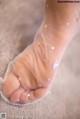 A close up of a person's foot with white stars on it.